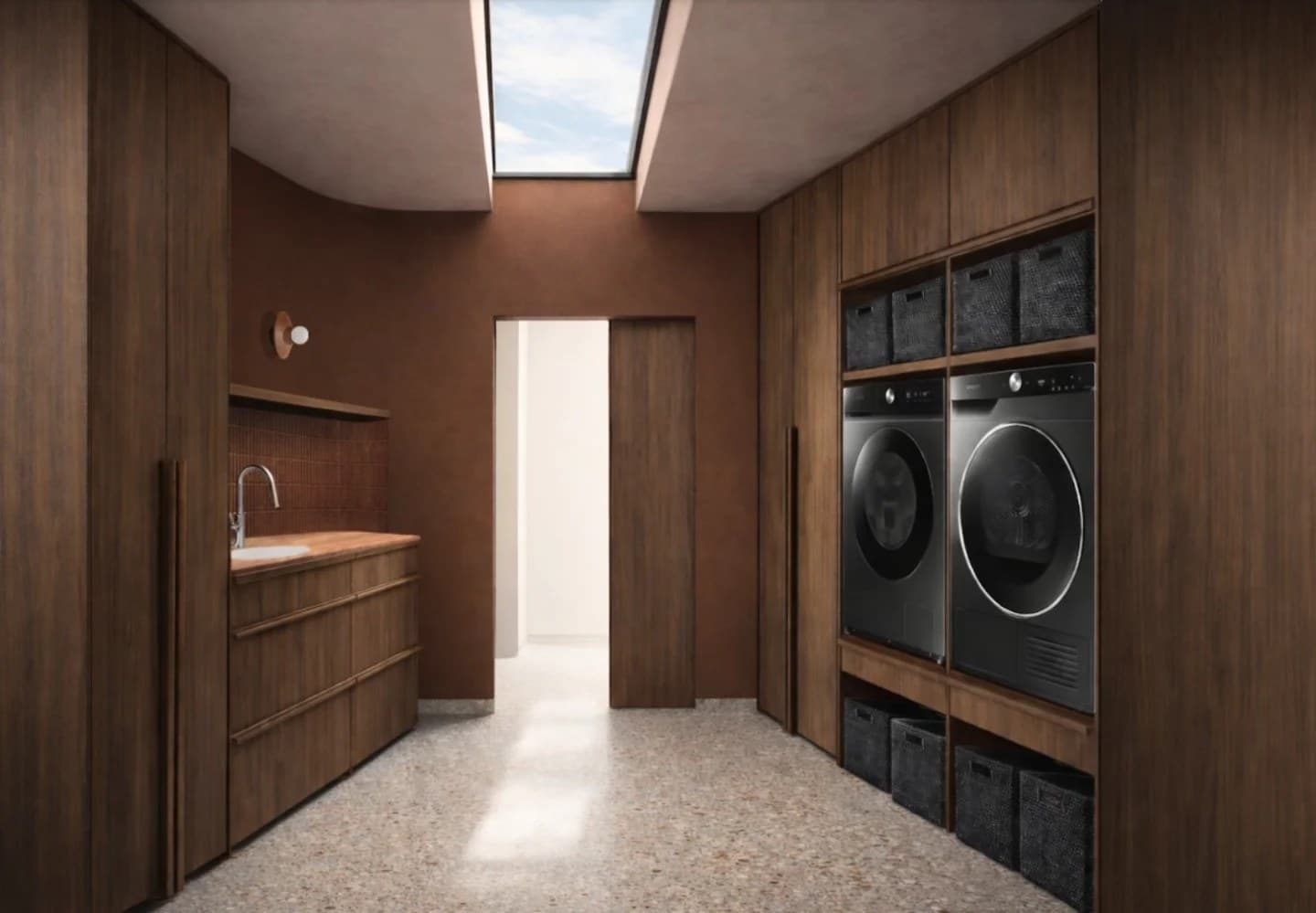 Laundry with walnut joinery, dark Venetian plaster walls, a terrazzo floor and a raised washer and dryer under a skylight